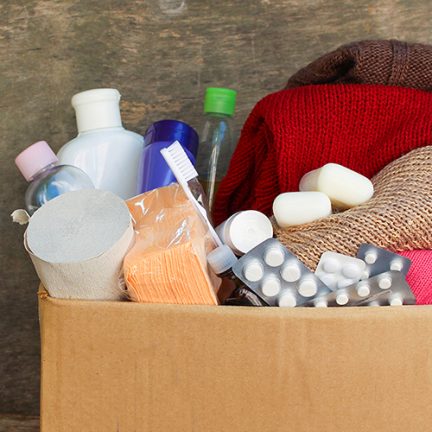 Donation box with clothes, living essentials